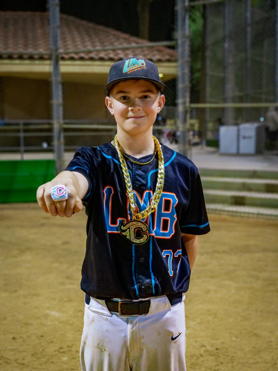 LMB player showing championship ring and bling
