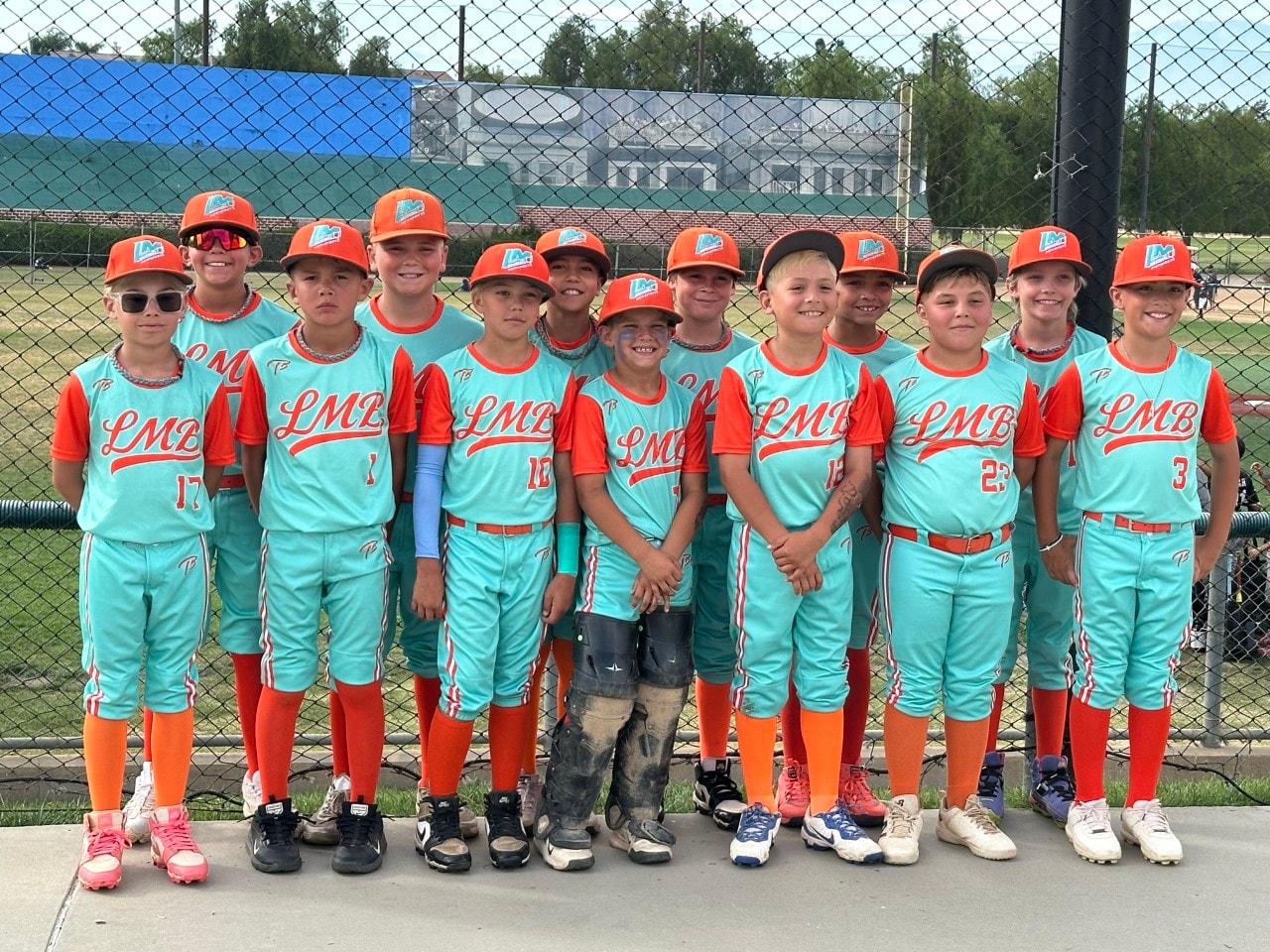LMB 11U team in teal and orange uniforms
